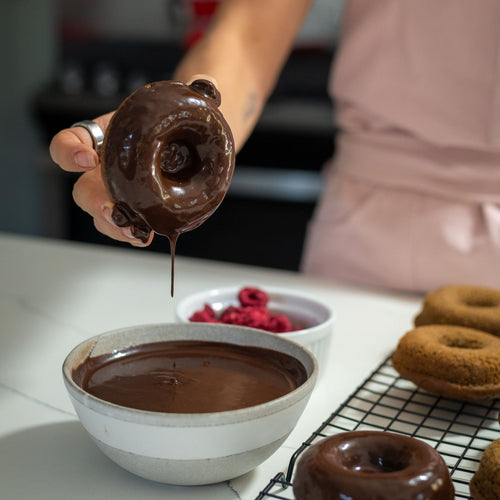 Woman dipping Gluten Free Donuts