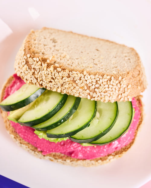 Gluten Free Sandwich with hummus and cucumbers on Sesame Bread