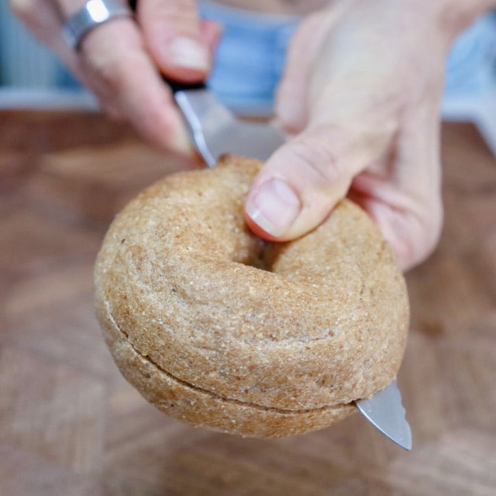 Plant Based Bagels being sliced open